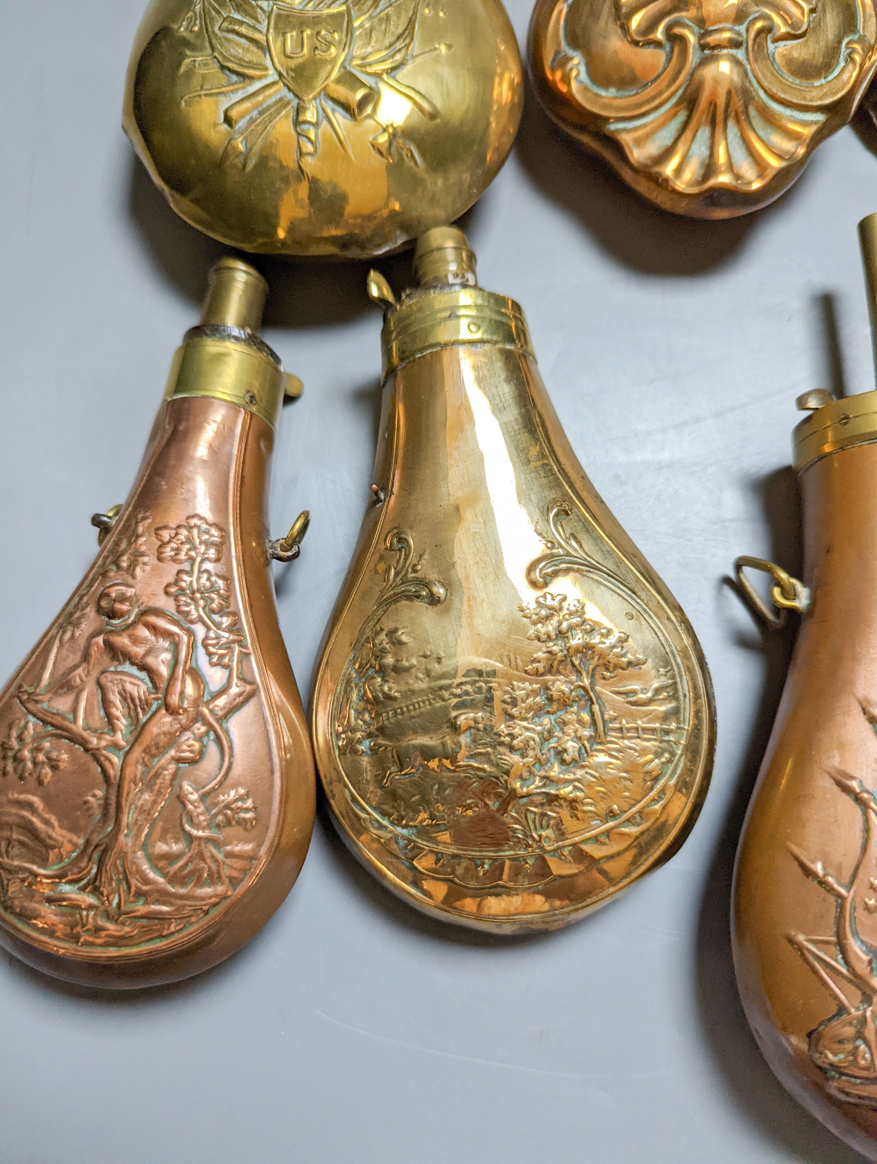 Eight assorted 19th century copper shot flasks